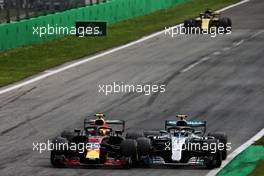 Max Verstappen (NLD) Red Bull Racing RB14 and Valtteri Bottas (FIN) Mercedes AMG F1 W09 battle for position. 02.09.2018. Formula 1 World Championship, Rd 14, Italian Grand Prix, Monza, Italy, Race Day.