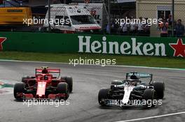 Lewis Hamilton (GBR) Mercedes AMG F1 W09 passes Kimi Raikkonen (FIN) Ferrari SF71H to take the lead of the race. 02.09.2018. Formula 1 World Championship, Rd 14, Italian Grand Prix, Monza, Italy, Race Day.