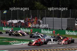 Kimi Raikkonen (FIN) Ferrari SF71H leads at the start of the race. 02.09.2018. Formula 1 World Championship, Rd 14, Italian Grand Prix, Monza, Italy, Race Day.