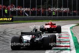 Kimi Raikkonen (FIN) Ferrari SF71H leads Lewis Hamilton (GBR) Mercedes AMG F1 W09. 02.09.2018. Formula 1 World Championship, Rd 14, Italian Grand Prix, Monza, Italy, Race Day.