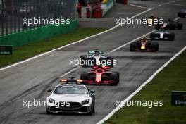 Kimi Raikkonen (FIN) Ferrari SF71H leads behind the FIA Safety Car. 02.09.2018. Formula 1 World Championship, Rd 14, Italian Grand Prix, Monza, Italy, Race Day.
