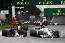 Daniel Ricciardo (AUS) Red Bull Racing RB14 and Charles Leclerc (MON) Sauber F1 Team C37 battle for position. 02.09.2018. Formula 1 World Championship, Rd 14, Italian Grand Prix, Monza, Italy, Race Day.