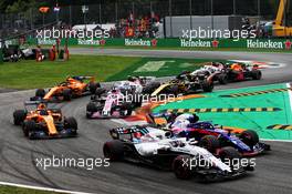 Sergey Sirotkin (RUS) Williams FW41 and Pierre Gasly (FRA) Scuderia Toro Rosso STR13 at the start of the race. 02.09.2018. Formula 1 World Championship, Rd 14, Italian Grand Prix, Monza, Italy, Race Day.