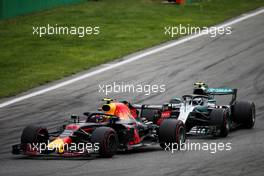 Max Verstappen (NLD) Red Bull Racing RB14 leads Valtteri Bottas (FIN) Mercedes AMG F1 W09. 02.09.2018. Formula 1 World Championship, Rd 14, Italian Grand Prix, Monza, Italy, Race Day.