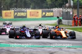(L to R): Pierre Gasly (FRA) Scuderia Toro Rosso STR13 and Fernando Alonso (ESP) McLaren MCL33 battle for position. 02.09.2018. Formula 1 World Championship, Rd 14, Italian Grand Prix, Monza, Italy, Race Day.