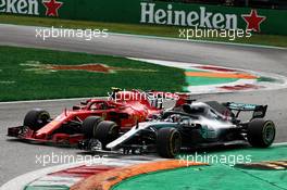 Lewis Hamilton (GBR) Mercedes AMG F1 W09 passes Kimi Raikkonen (FIN) Ferrari SF71H to take the lead of the race. 02.09.2018. Formula 1 World Championship, Rd 14, Italian Grand Prix, Monza, Italy, Race Day.