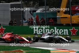 Lewis Hamilton (GBR) Mercedes AMG F1 W09 passes Kimi Raikkonen (FIN) Ferrari SF71H to take the lead of the race. 02.09.2018. Formula 1 World Championship, Rd 14, Italian Grand Prix, Monza, Italy, Race Day.