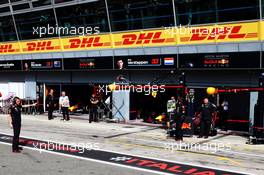 Red Bull Racing pit garages with Max Verstappen (NLD) Red Bull Racing RB14 about to leaves the pits. 01.09.2018. Formula 1 World Championship, Rd 14, Italian Grand Prix, Monza, Italy, Qualifying Day.