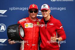 Kimi Raikkonen (FIN) Ferrari receives the Pirelli Pole Position award from Mick Schumacher (GER) Formula Three Driver. 01.09.2018. Formula 1 World Championship, Rd 14, Italian Grand Prix, Monza, Italy, Qualifying Day.