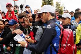 Pierre Gasly (FRA) Scuderia Toro Rosso STR13 signs autographs for the fans. 01.09.2018. Formula 1 World Championship, Rd 14, Italian Grand Prix, Monza, Italy, Qualifying Day.