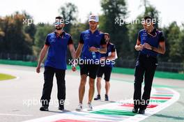 Pierre Gasly (FRA) Scuderia Toro Rosso walks the circuit with the team. 30.08.2018. Formula 1 World Championship, Rd 14, Italian Grand Prix, Monza, Italy, Preparation Day.