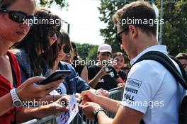 Stoffel Vandoorne (BEL) McLaren signs autographs for the fans. 30.08.2018. Formula 1 World Championship, Rd 14, Italian Grand Prix, Monza, Italy, Preparation Day.