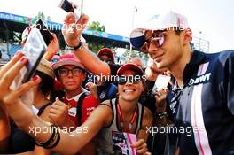 Esteban Ocon (FRA) Racing Point Force India F1 Team with fans. 30.08.2018. Formula 1 World Championship, Rd 14, Italian Grand Prix, Monza, Italy, Preparation Day.