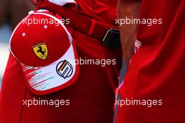 The cap of Sebastian Vettel (GER) Ferrari held by Britta Roeske (AUT) Ferrari Press Officer. 30.08.2018. Formula 1 World Championship, Rd 14, Italian Grand Prix, Monza, Italy, Preparation Day.