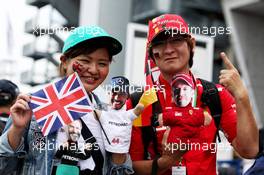 Lewis Hamilton (GBR) Mercedes AMG F1 and Sebastian Vettel (GER) Ferrari fans. 05.10.2018. Formula 1 World Championship, Rd 17, Japanese Grand Prix, Suzuka, Japan, Practice Day.