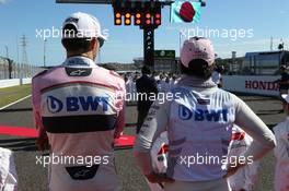 Esteban Ocon (FRA) Sahara Force India F1 VJM11 and Sergio Perez (MEX) Sahara Force India F1 VJM11. 07.10.2018. Formula 1 World Championship, Rd 17, Japanese Grand Prix, Suzuka, Japan, Race Day.