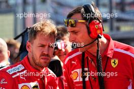 Sebastian Vettel (GER) Ferrari with Riccardo Adami (ITA) Ferrari Race Engineer on the grid. 07.10.2018. Formula 1 World Championship, Rd 17, Japanese Grand Prix, Suzuka, Japan, Race Day.