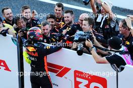 Max Verstappen (NLD) Red Bull Racing celebrates his third position in parc ferme with the team. 07.10.2018. Formula 1 World Championship, Rd 17, Japanese Grand Prix, Suzuka, Japan, Race Day.