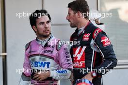 (L to R): Sergio Perez (MEX) Racing Point Force India F1 Team with Romain Grosjean (FRA) Haas F1 Team in parc ferme. 07.10.2018. Formula 1 World Championship, Rd 17, Japanese Grand Prix, Suzuka, Japan, Race Day.