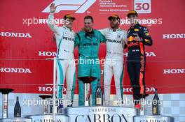 1st place Lewis Hamilton (GBR) Mercedes AMG F1 W09 with 2nd place Valtteri Bottas (FIN) Mercedes AMG F1 and 3rd place Max Verstappen (NLD) Red Bull Racing RB14. 07.10.2018. Formula 1 World Championship, Rd 17, Japanese Grand Prix, Suzuka, Japan, Race Day.