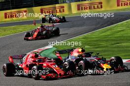 Max Verstappen (NLD) Red Bull Racing RB14 and Kimi Raikkonen (FIN) Ferrari SF71H battle for position. 07.10.2018. Formula 1 World Championship, Rd 17, Japanese Grand Prix, Suzuka, Japan, Race Day.