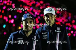 (L to R): Sergio Perez (MEX) Racing Point Force India F1 Team with Esteban Ocon (FRA) Racing Point Force India F1 Team with the fans at night time. 06.10.2018. Formula 1 World Championship, Rd 17, Japanese Grand Prix, Suzuka, Japan, Qualifying Day.