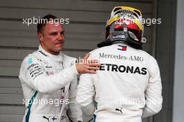 (L to R): Second placed Valtteri Bottas (FIN) Mercedes AMG F1 congratulates his team mate Lewis Hamilton (GBR) Mercedes AMG F1 on his 80th pole position in qualifying parc ferme. 06.10.2018. Formula 1 World Championship, Rd 17, Japanese Grand Prix, Suzuka, Japan, Qualifying Day.