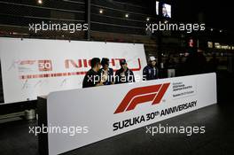 Sergio Perez (MEX) Racing Point Force India F1 Team and Esteban Ocon (FRA) Racing Point Force India F1 Team with the fans at night time. 06.10.2018. Formula 1 World Championship, Rd 17, Japanese Grand Prix, Suzuka, Japan, Qualifying Day.
