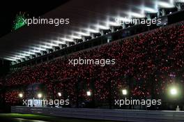 Fans in the grandstand at night time. 06.10.2018. Formula 1 World Championship, Rd 17, Japanese Grand Prix, Suzuka, Japan, Qualifying Day.