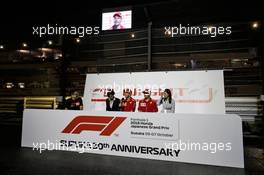 (L to R): Sebastian Vettel (GER) Ferrari and Kimi Raikkonen (FIN) Ferrari with the fans at night time. 06.10.2018. Formula 1 World Championship, Rd 17, Japanese Grand Prix, Suzuka, Japan, Qualifying Day.