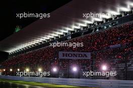 Fans in the grandstand at night time. 06.10.2018. Formula 1 World Championship, Rd 17, Japanese Grand Prix, Suzuka, Japan, Qualifying Day.