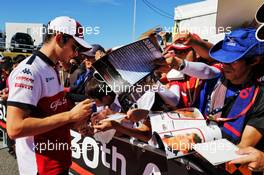 Charles Leclerc (MON) Sauber F1 Team signs autographs for the fans. 07.10.2018. Formula 1 World Championship, Rd 17, Japanese Grand Prix, Suzuka, Japan, Race Day.