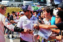 Sergio Perez (MEX) Racing Point Force India F1 Team and mhak sign autographs for the fans. 07.10.2018. Formula 1 World Championship, Rd 17, Japanese Grand Prix, Suzuka, Japan, Race Day.