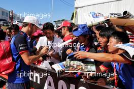 Pierre Gasly (FRA) Scuderia Toro Rosso signs autographs for the fans. 07.10.2018. Formula 1 World Championship, Rd 17, Japanese Grand Prix, Suzuka, Japan, Race Day.