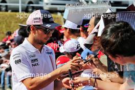 Sergio Perez (MEX) Racing Point Force India F1 Team signs autographs for the fans. 07.10.2018. Formula 1 World Championship, Rd 17, Japanese Grand Prix, Suzuka, Japan, Race Day.