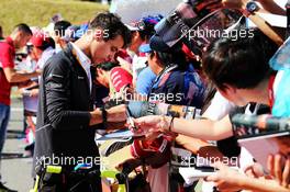 Lando Norris (GBR) McLaren Test Driver signs autographs for the fans. 07.10.2018. Formula 1 World Championship, Rd 17, Japanese Grand Prix, Suzuka, Japan, Race Day.