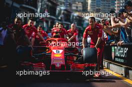 Ferrari SF71H pushed down the pit lane by mechanics. 25.05.2018. Formula 1 World Championship, Rd 6, Monaco Grand Prix, Monte Carlo, Monaco, Friday.
