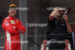 Sebastian Vettel (GER) Ferrari SF71H and Adrian Newey (GBR) Red Bull Racing Chief Technical Officer.  27.05.2018. Formula 1 World Championship, Rd 6, Monaco Grand Prix, Monte Carlo, Monaco, Race Day.