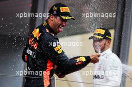 Race winner Daniel Ricciardo (AUS) Red Bull Racing celebrates on the podium with Lewis Hamilton (GBR) Mercedes AMG F1. 27.05.2018. Formula 1 World Championship, Rd 6, Monaco Grand Prix, Monte Carlo, Monaco, Race Day.