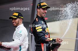 Race winner Daniel Ricciardo (AUS) Red Bull Racing celebrates on the podium with Lewis Hamilton (GBR) Mercedes AMG F1. 27.05.2018. Formula 1 World Championship, Rd 6, Monaco Grand Prix, Monte Carlo, Monaco, Race Day.