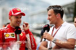 (L to R): Sebastian Vettel (GER) Ferrari with Will Buxton (GBR) F1 Digital Presenter. 27.05.2018. Formula 1 World Championship, Rd 6, Monaco Grand Prix, Monte Carlo, Monaco, Race Day.