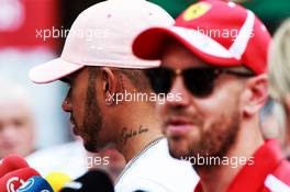 (L to R): Lewis Hamilton (GBR) Mercedes AMG F1 and Sebastian Vettel (GER) Ferrari with the media. 23.05.2018. Formula 1 World Championship, Rd 6, Monaco Grand Prix, Monte Carlo, Monaco, Preparation Day.