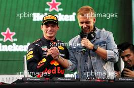 (L to R): Race winner Max Verstappen (NLD) Red Bull Racing celebrates on the podium with Armin van Buuren (NLD) DJ. 28.10.2018. Formula 1 World Championship, Rd 19, Mexican Grand Prix, Mexico City, Mexico, Race Day.