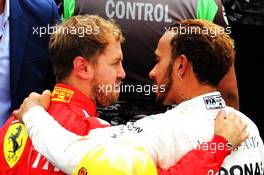 Race winner Lewis Hamilton (GBR) Mercedes AMG F1 celebrates winning the World Championship in parc ferme with Sebastian Vettel (GER) Ferrari. 28.10.2018. Formula 1 World Championship, Rd 19, Mexican Grand Prix, Mexico City, Mexico, Race Day.