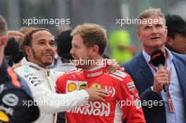 Lewis Hamilton (GBR) Mercedes AMG F1 W09 celebrates his 5th World Championship and Sebastian Vettel (GER) Ferrari SF71H.. 28.10.2018. Formula 1 World Championship, Rd 19, Mexican Grand Prix, Mexico City, Mexico, Race Day.