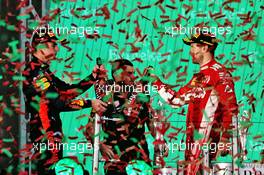 (L to R): Race winner Max Verstappen (NLD) Red Bull Racing celebrates on the podium with second placed Sebastian Vettel (GER) Ferrari. 28.10.2018. Formula 1 World Championship, Rd 19, Mexican Grand Prix, Mexico City, Mexico, Race Day.