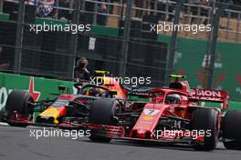 Kimi Raikkonen (FIN) Scuderia Ferrari and Max Verstappen (NLD) Red Bull Racing  28.10.2018. Formula 1 World Championship, Rd 19, Mexican Grand Prix, Mexico City, Mexico, Race Day.
