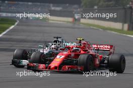Kimi Raikkonen (FIN) Ferrari SF71H and Lewis Hamilton (GBR) Mercedes AMG F1 W09. 28.10.2018. Formula 1 World Championship, Rd 19, Mexican Grand Prix, Mexico City, Mexico, Race Day.