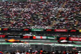 Kevin Magnussen (DEN) Haas VF-18 leads Stoffel Vandoorne (BEL) McLaren MCL33. 27.10.2018. Formula 1 World Championship, Rd 19, Mexican Grand Prix, Mexico City, Mexico, Qualifying Day.