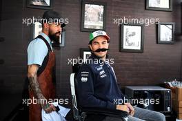 Sergio Perez (MEX) Racing Point Force India F1 Team visits the paddock barbers. 25.10.2018. Formula 1 World Championship, Rd 19, Mexican Grand Prix, Mexico City, Mexico, Preparation Day.